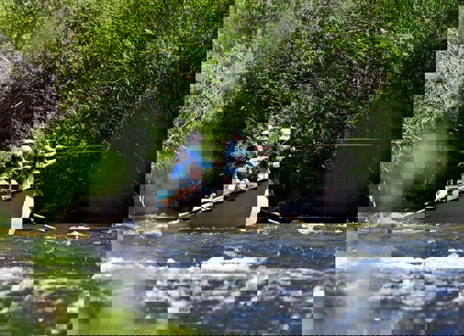Fly fishing from a boat on the Gunnison River.